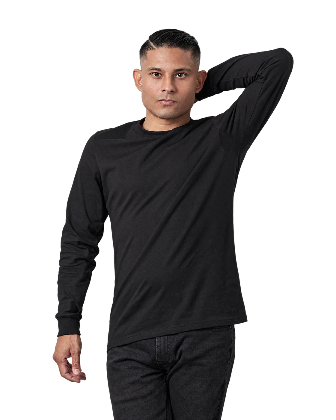 Bruno Stephen in a black long-sleeved top, with one arm raised behind the head
